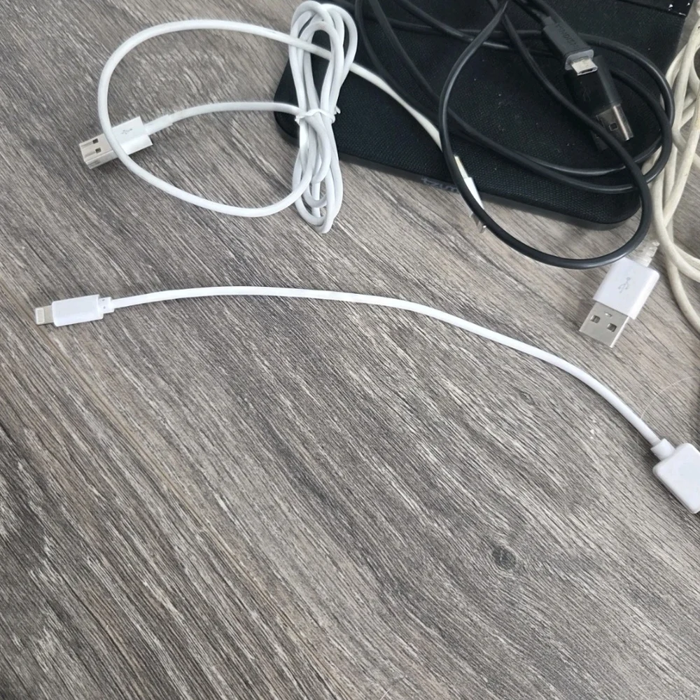Assorted White and Black Mobile Charging Cables with Pink Accents